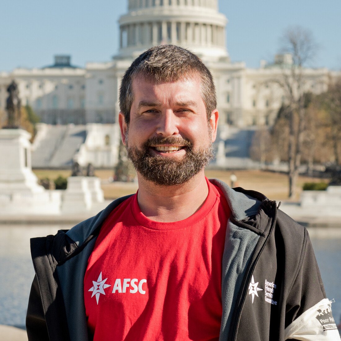 Headshot of Jacob Flowers in front of the U.S. capitol